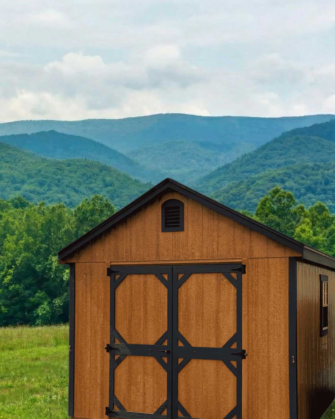 Amish-built wood-stained shed with custom door trim overlooking the Blue Ridge Mountains — Shenandoah Sheds, White Post, Virginia